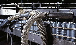 Since containers must be completely dry prior to shrink labeling, they pass through a series of air blowers that remove all resi