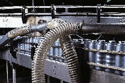 Since containers must be completely dry prior to shrink labeling, they pass through a series of air blowers that remove all resi