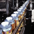 A custom-built seal tester squeezes bottles through a succession of vertical rollers to expose leakers or poor seals