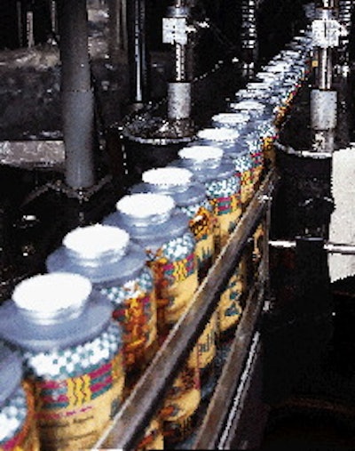 A custom-built seal tester squeezes bottles through a succession of vertical rollers to expose leakers or poor seals