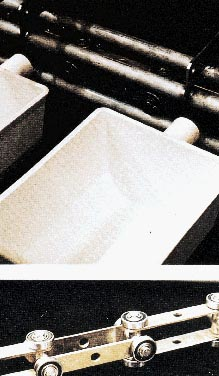 Injection-molded plastic buckets like these (top) carry ?long goods? pasta. Transporting these buckets vertically, horizontally