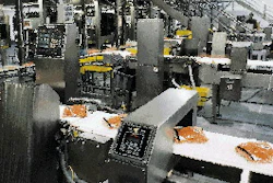 Grimmway1s checkweigher and metal detectors (right) inspect up to 75 bags of carrots per minute. The plant produces bags from 1