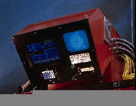 Inside the blow molding machine, one of Ball?s 2-L bottles is positioned at the vision inspection station. Images flash across t