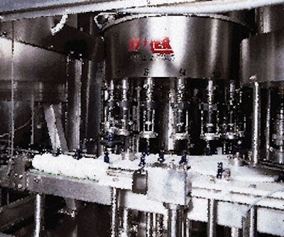 At the machine1s infeed, bottles are first handed off to the 16-valve fill-to-level filler (above). Platforms elevate each bott
