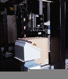 As a case nears the print-and-apply labeling system, it passes between two 3towers2 that form a 100-watt light 3curtain2. As