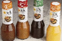 Semi-automatic capping (above) helps Nakano Foods keep capital costs down as it gauges demand for new products like its Mitsukan