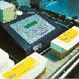 This portable coder, shown coding 5-lb loaf cheese sold to supermarket delis, can be wheeled to different production lines as ne