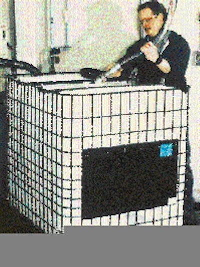 At Wacker Silicones, an operator fills an IBC with a silicone-based product. Consisting of an HDPE bottle enclosed in a steel ca