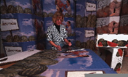 Tom Connelly (above) stands on a catwalk over the discharge station of the #10 press as four-color process-printed watermelon bi