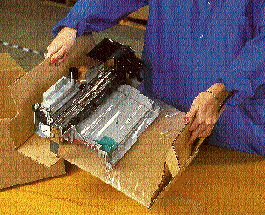 HP?s delicate printhead replacement assembly is immobilized beneath the flexible urethane film that?s spot-glued at the edges to