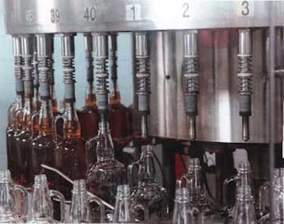 The 40-valve gravity/vacuum filler selected by Jim Beam minimizes product foaming to permit filling speeds of 180 bottles/min. T