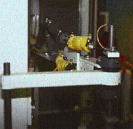 As many as six upstream packaging lines can feed into the rotary tower stretch wrapping machine. Electrical heating strips on al