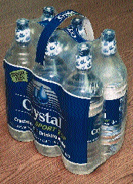 McKesson is among the first in the U.S. to use this handled six-pack bundle (left); the Crystal brand is one of three sold by th