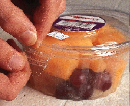 The PS resin used for Wilkinson?s DeltaPak, shown here in the trim press, has a modifier that gives the container just the right