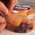 The PS resin used for Wilkinson?s DeltaPak, shown here in the trim press, has a modifier that gives the container just the right