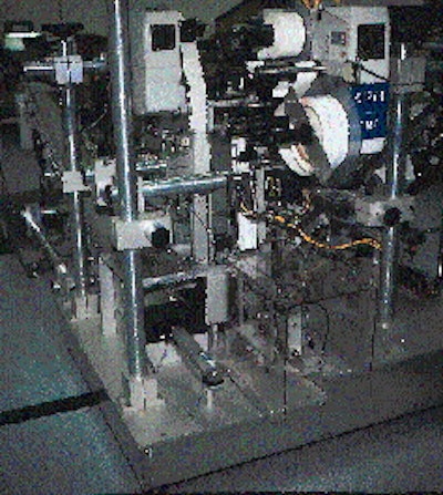 Within this chamber, two side-by-side cartons are labeled at each of their ends simultaneously to create a unit pack