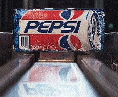 On their way to palletizing, 12-packs of Pepsi are gently conveyed on two tracks of coated plastic chain (above). When packs bac