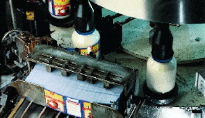 Hot melt adhesive is applied to thetrailing edge of labels as they?re applied to jars