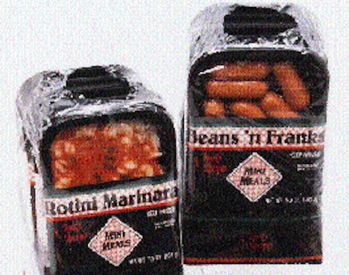 Five Mini Meals are manually loaded into a chipboard ?boot? and overwrapped in film for multipack sales