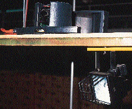 One of the bottling plant?s versatile video cameras is mounted high above the case packer; another camera is portable