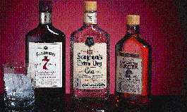 The quick-change rotary orienter (top) properly aligns three 375-ml flasks sold in two distinctive shapes (above