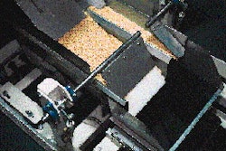 At each of the five net weigh fillers, product flows from vibratory feeders (right) into the weigh bucket. The filler in the abo