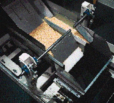 At each of the five net weigh fillers, product flows from vibratory feeders (right) into the weigh bucket. The filler in the abo