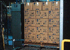 While the loading area of the automatic palletizer is stationary, its shuttle portion carries as many as five pallets at a time.