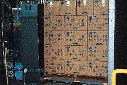 While the loading area of the automatic palletizer is stationary, its shuttle portion carries as many as five pallets at a time.