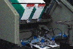 An automatic card feeder places cards face down over the formed and filled blisters