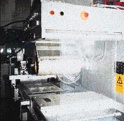 Sm4;genFisk?s thermoforming/sealing machine (top) uses a roll of 18.5-mil polyester/PE sheet that unwinds from left to right. T
