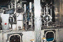 Cartons are presterilized, filled and sealed within the aseptic chamber, which runs along the bottom of the system