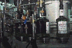 Brushes wipe neck and body labels onto spirits bottles on Heaven Hill?s PET filling line (above), and to 750-mL square glass bot