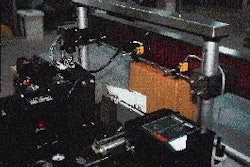 On one of Sandoz?s four corner-wrap labelers, the freshly printed bar code label is first tamped on and subsequently wrapped aro