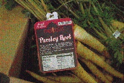 A World Variety employee applies tags while trimming and repackaging produce for delivery to a retailer. A Melissa?s? tag (left)