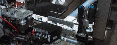 A scanner on the labeler verifies bar codes as labels unwind from rollstock. Two similar scanners are mounted on the cartoner an