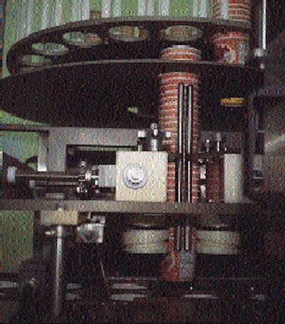 Ontario Foods was one of the first to use these automatic rotary cup feeders (above), which drop fresh columns of cups into th