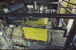 At Bandini, once a load is positioned on the turntable of the stretch wrapper (top), the top sheet is pulled out in the film fra
