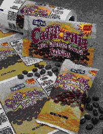 Process technicians David Greene and David Craft (above) observe the control console of the 10-station gravure press. The printe