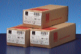 After boxes of achitectural hinges (far left) are glued shut, a label is tamped onto the tops. (Left) The final product is label