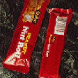 An operator uses a hand-held scanning device to check color consistency (top) on the printed web as it moves through American Pa