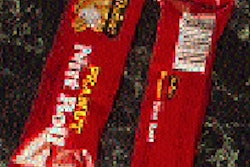 An operator uses a hand-held scanning device to check color consistency (top) on the printed web as it moves through American Pa