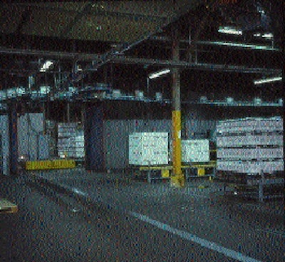 Two full pallet discharge stations are shown here, and immediately in front of them is the grooved track that guides the automat