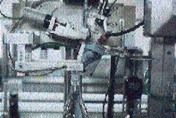 A 70-micron oriented PP sleeve label is applied to the filled and capped PET bottle prior to proceeding through a shrink tunnel