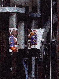 Flat blanks fed from a magazine are pressed around a forming mandrel to produce the desired oval shape