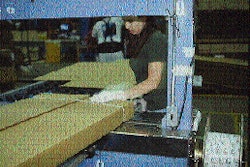 With one strap already in place (top), the operator holds down the flaps as a second strap is applied. Because the corrugated co