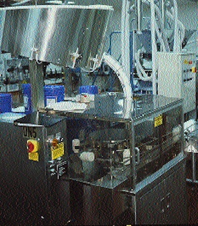 In an Apotex line occupied by two electronic counter/fillers, bottles leave an automated unscrambler (right) and then are gat
