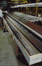 Plymouth Tube?s long lengths of stainless steel tubing require boxes up to 25? long (above). To help stabilize the long containe