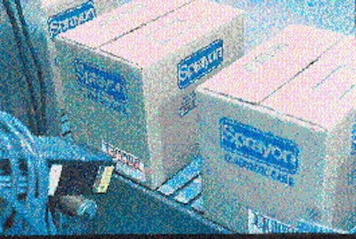 Cases of aerosol products are conveyed to the labeler (top) where bar-coded labels are printed then applied using the tamp-blow
