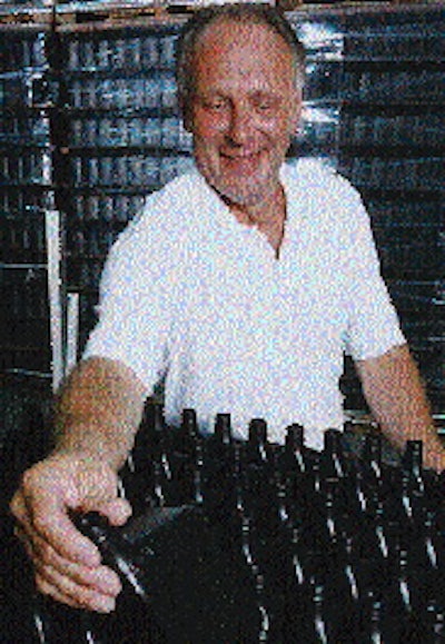 Above: Gary Kulling, plant manager at CPC?s new plant inspects bottles destined to become Coastal Unilube (above, right). At CPC